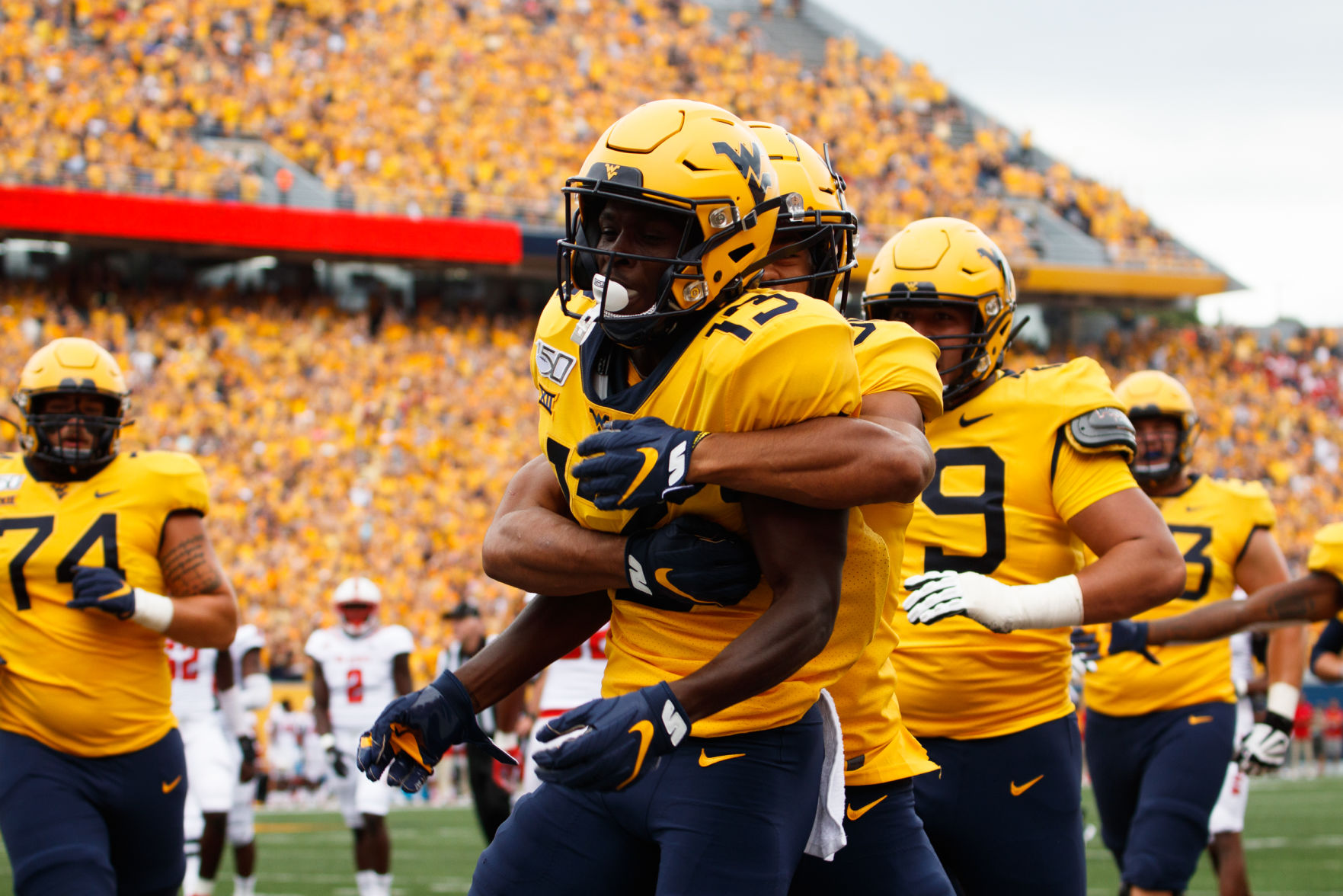 West Virginia's Sam James and Randy Fields Jr. celebrate a touchdown Saturday against NC State.